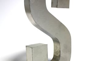 Close-up of a metallic letter S sculpture made of silver iron on a white background.